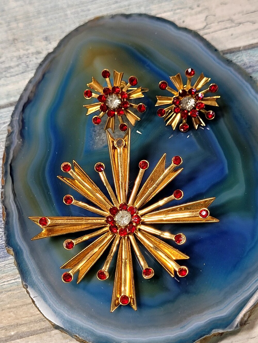 Gold Starburst Brooch and Earring Set with Red Rhinestones